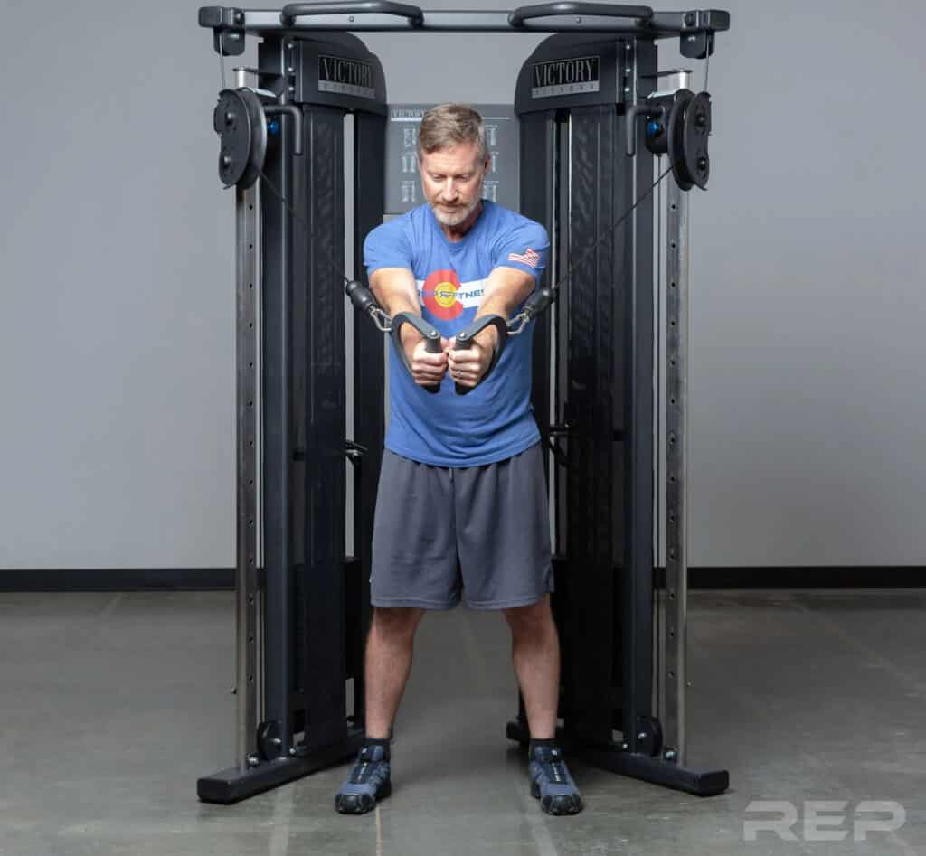 Rep Fitness REP FT-3000 Compact Functional Trainer with a user 1